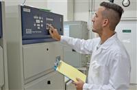 Q-Lab Florida’s lab manager inspecting a QUV tester in preparation for a new customer test.